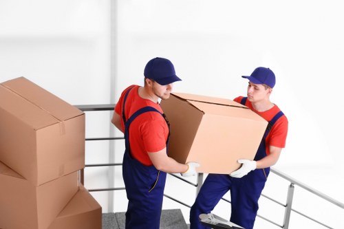 House removal team preparing a Bermondsey flat move with boxes and furniture