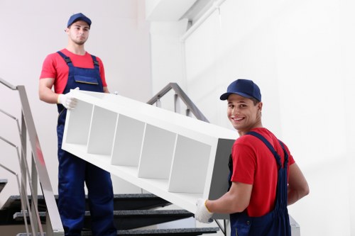 Organised house move in Bermondsey with labelled boxes and removal equipment