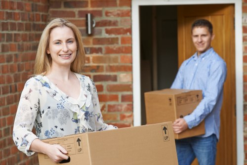 Furniture and boxes being loaded into a removals van